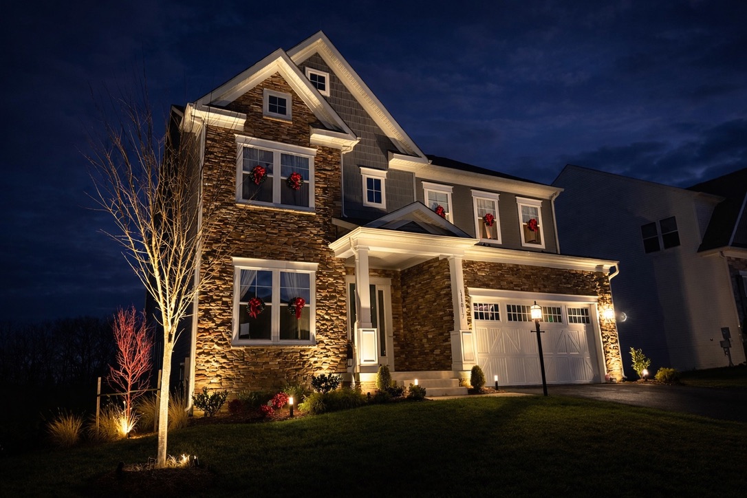 Landscape lighting illuminating a Northern Virginia home and front landscape